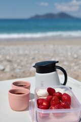 strawberries and coffee on the sea
