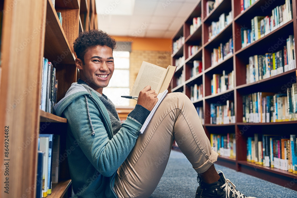 Poster University student, man and portrait with writing in library for studying, scholarship and reading a book for exam info. Education, person and happy with notebook for research and knowledge on floor