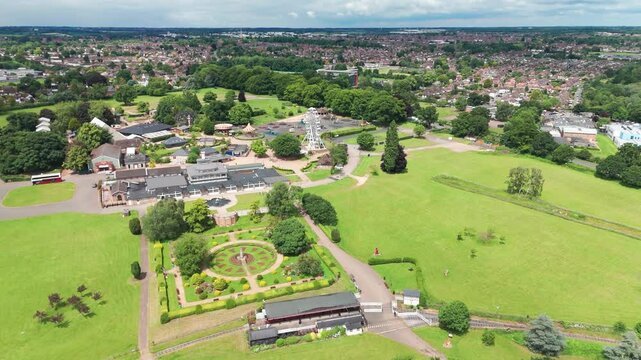 Aerial shot of Wicksteed Park with Kettering town during sunny afternoon in England.