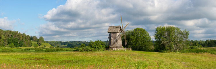 An old windmill in a field. Mikhailovskoye, Pushkin Mountains. Pskov region, Russia