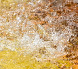 Splashes of water in a fountain in the park