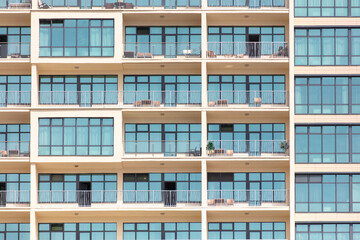 Multi-storey building with windows as background. Text