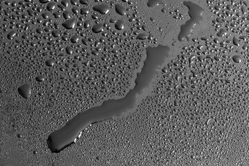 Water drops on a black background. Texture