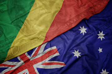 waving colorful flag of republic of the congo and national flag of australia on the dollar money background. finance concept.