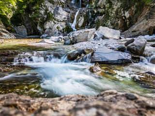 Waterfall and dam in the Julian Prealps. Crosis, pearl of Tarcento. Nature and engineering.