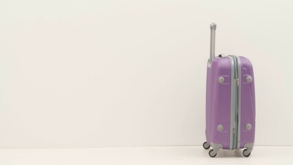 Purple suitcase standing alone against a white background
