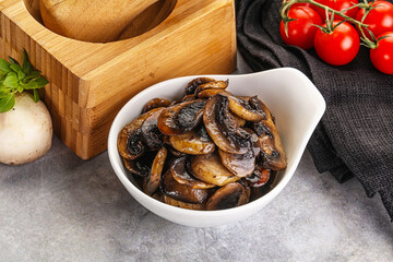 Roasted champignon mushrooms in the bowl