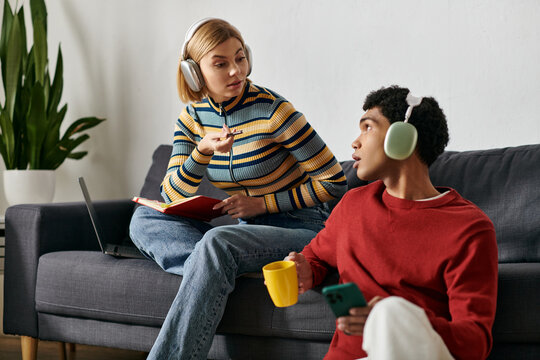 A young multicultural couple relaxes in their shared apartment, enjoying a cozy afternoon together.