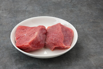 Fresh raw beef (daging sapi), food preparation.

