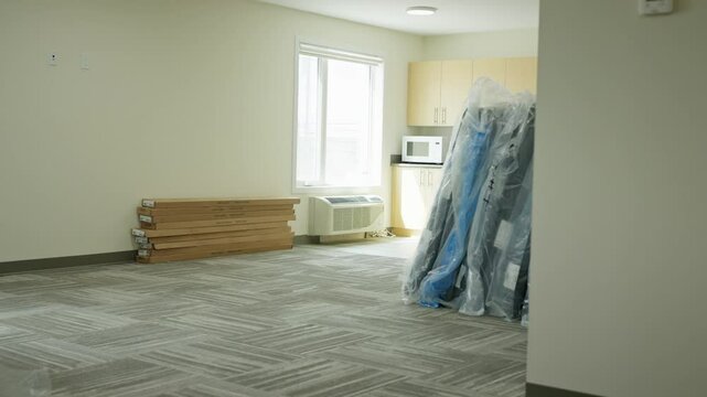 Camera Pans Across Stacks of New Mattresses Delivered to New Condo Building