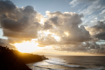 Seascape with large golden clouds at sunset. Tenerife, Spain.