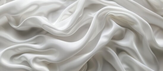 Fototapeta premium Soft wavy abstract on a white fabric background.