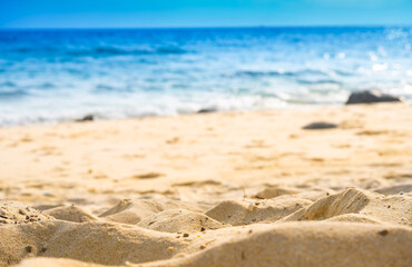 Nature of the beach and sea Summer with sunshine, sandy beaches, clear blue waters sparkling against the blue sky. On an island with good ecology and environment Background for summer vacation concept