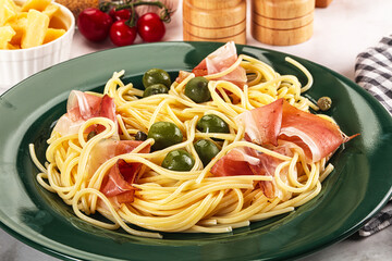 Pasta spaghetti with olives and jamon