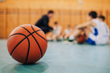 Close-up of a basketball on a gym floor