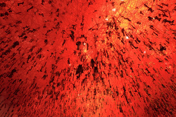 Red keys hanging from ceiling creating abstract background