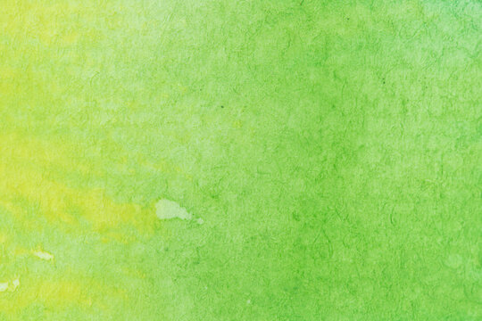 green, yellow watercolor, paint stroke gradient color combination on drawing paper use as background