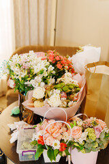Large beautiful bouquets of different delicate flowers. A traditional gift for the holiday.