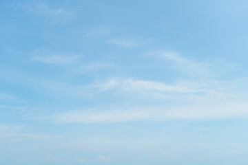 Fluffy blue sky background and white clouds soft focus, and copy space