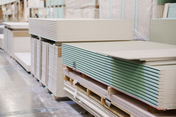  water repellent gypsum board on a rack in a hardware store. sale of building materials for repair...