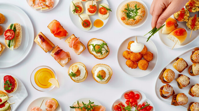 Various type many kinds of finger food on the white table background