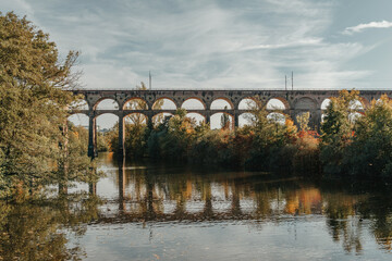 Railway Bridge with river in Bietigheim-Bissingen, Germany. Autumn. Railway viaduct over the Enz...