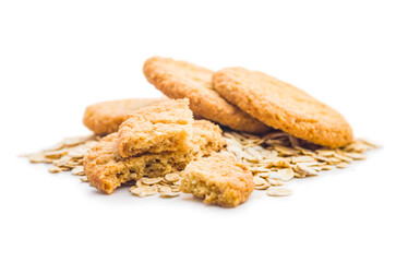 Tasty oatmeal cookies and rolled oat  isolated on white background.