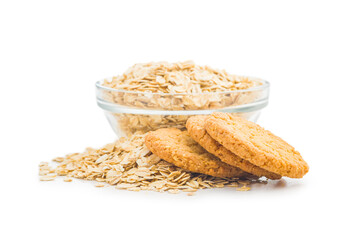 Tasty oatmeal cookies and rolled oat  isolated on white background.