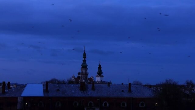 ZAMOSC, POLAND - OCTOBER 30 2017: Town Hall in Zamosc - mannerist-baroque, main building in Zamosc. It is located in northern frontage of Great Market Square. It has clock tower and fan-shaped stairs.