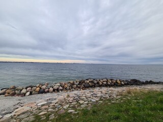 beach, stones and cloudy sky in Helsing&oslash;r, a wonderful city in denmark/scandinavia/europe