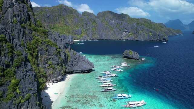 Aerial footage of the moored boats off the shore of Shimizu Island in El Nido, Palawan, Philippines