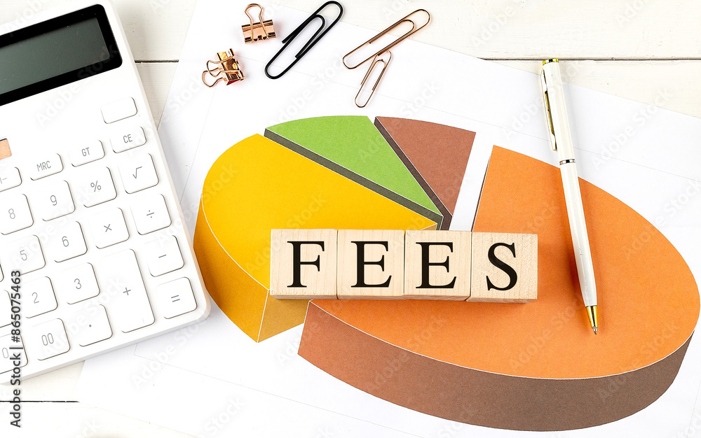 Poster fees word on wooden block on chart background