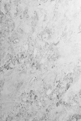 A textured wall with natural shadows illuminated by natural light.