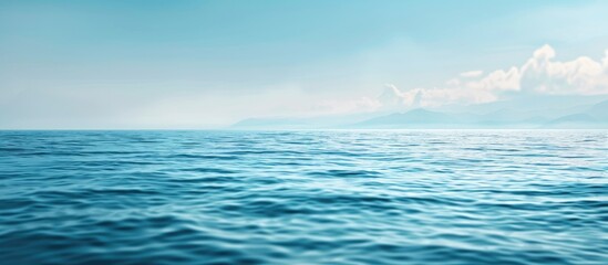 Obraz premium Blue sea with empty horizon and blurred foreground