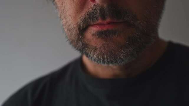Closeup of adult male mouth swallowing medical pill
