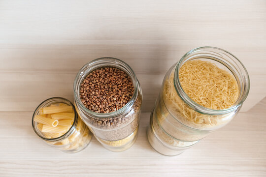 Eco packaging for products. Close-up of buckwheat and bulgur in jars.