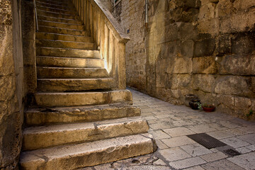 ancient courtyard in the historic ancient centre of Split, Croatia. Ancient buildings with staircase in Split, Croatia