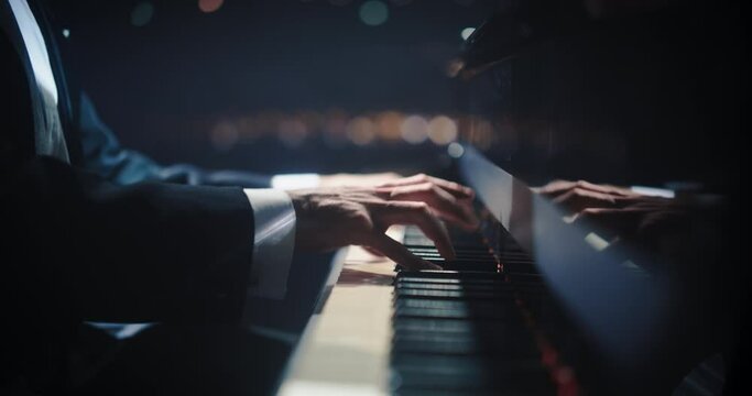 Close Up on Pianist Hands Playing a Mesmerizing Jazz Melody on a Black Grand Piano. Anonymous Artist is Focused on Creating Beautiful Instrumental Sonata as He Plays on Stage for the Audience