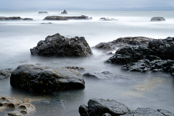 Obraz premium Long exposure of rocks on Sombrio Beach, Port Renfrew, BC Canada