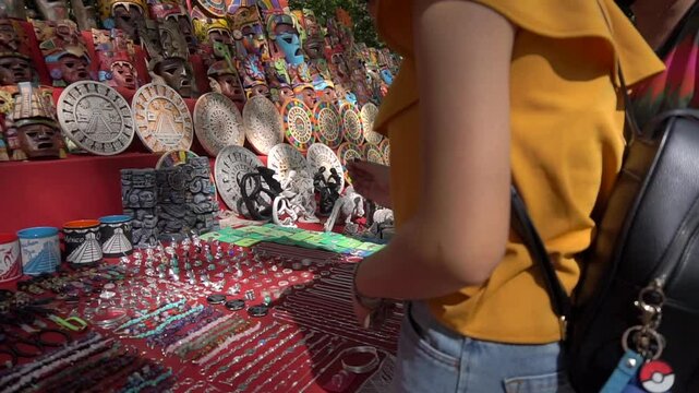 Touists are buying souvenirs near Chichen Itza, famous for the Kukulkan Temple or El Castillo pyramid. Pista, Mexico