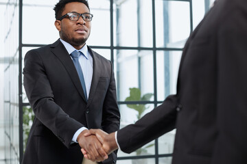 young black businessman shaking hands in the office