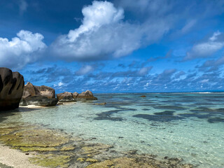 Beautiful seascapes of Seychelles islands with sun and turquoise waters