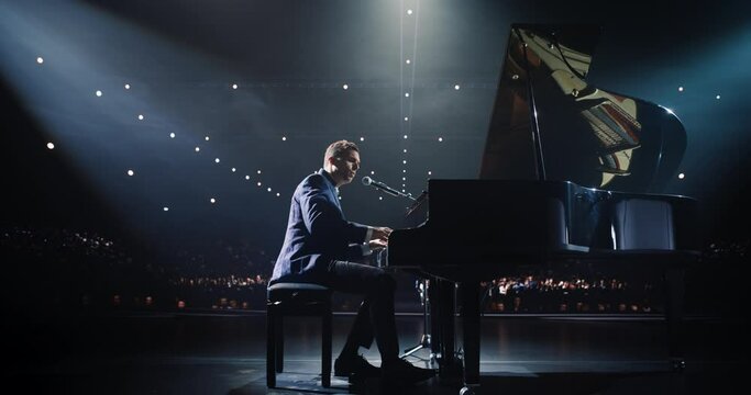 Young Pianist Playing and Singing, Performing an Experimental Solo Compositions on Stage. Grand Piano Resounds With Rich, Melodic Tones of a Romantic Ballad, Pianist Leaving the Audience in Awe