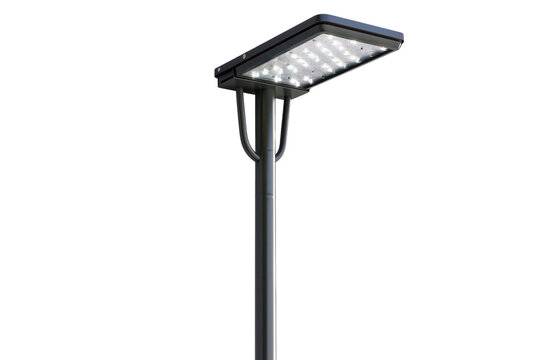 Modern street lamp post with a rectangular LED light fixture.  Isolated on a black background.  Perfect for urban design and infrastructure projects.