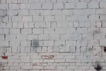 White brick wall and a beautiful window. Brick wall texture.