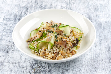 burley with fresh vegetables on white plate