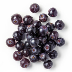 A handful of fresh, juicy maqui berries with a dark purple hue, isolated on white background