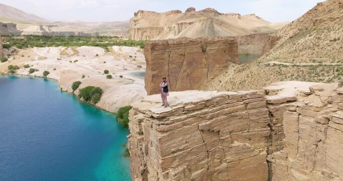 Man On Top Of Cliff At Band-e Amir National Park In Afghanistan - Drone Shot