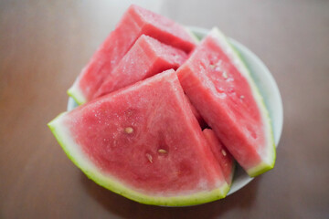 Fresh sliced watermelon in plate on table