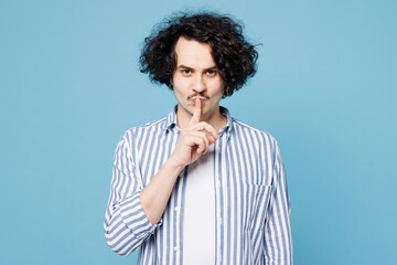 Young secret man he wear shirt white t-shirt casual clothes say hush be quiet with finger on lips...